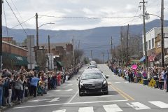 People line the street to pay respects as the hearse carrying the body of Rev. Billy Graham travels through Black Mountain, N.C., Saturday, Feb. 24, 2018. (AP Photo/Kathy Kmonicek, Pool)