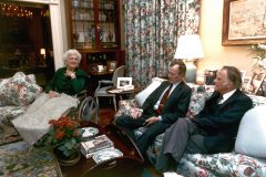 In 1991, Billy Graham visits President George H.W. Bush and his wife Barbara at the White House.
