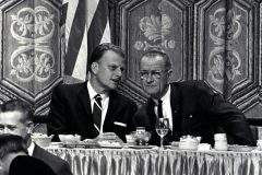 Billy Graham speaks with President Lyndon B. Johnson at the 1966 National Prayer Breakfast in Washington.