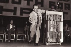 Billy Graham begins his public ministry with the Youth for Christ organization in 1945.