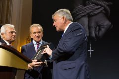May 12: As a token of appreciation for Franklin Graham's efforts to draw attention to the worldwide persecution of Christians, Pastor Sami Dagher from Lebanon and summit organizer Viktor Hamm present Graham with an Aramaic Bible that was salvaged from the remains of a church in Northern Iraq that was destroyed by ISIS.