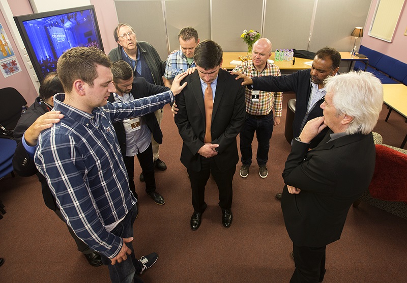 Wil Graham being prayed over in Scotland