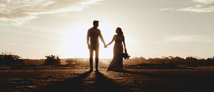 A couple holding hands.